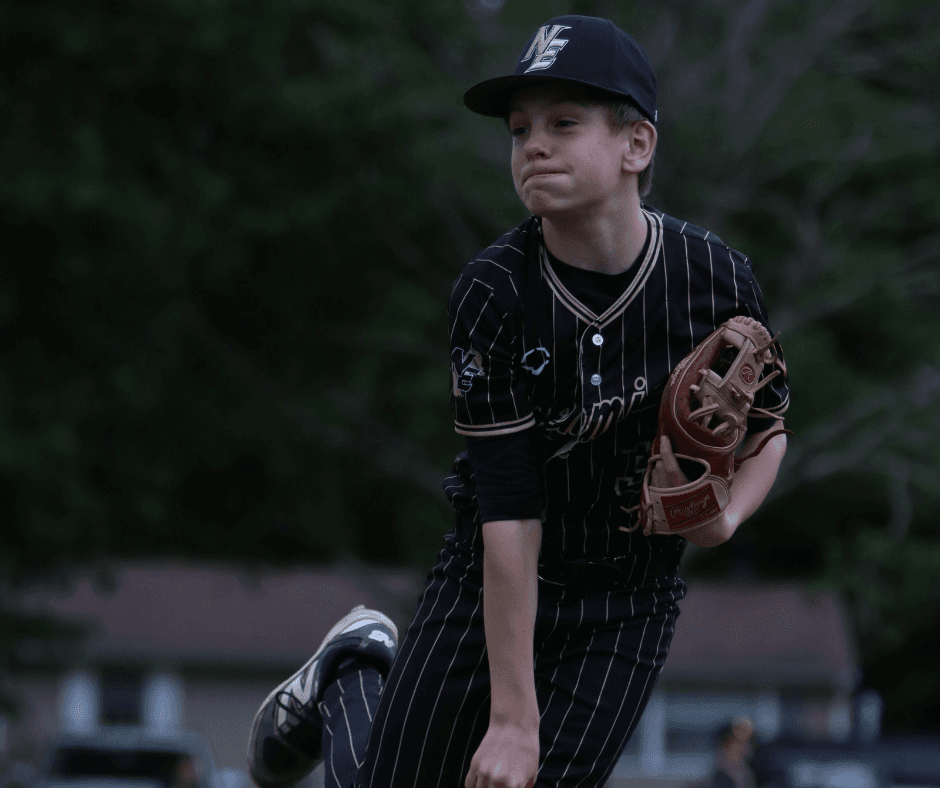 Young pitcher learning throwing mechanics at Jr Ghost